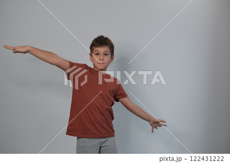 A jovial lean, in simple attire, encapsulates the current move towards capturing the unscripted beauty of childhood in photography. A jovial lean, in simple attire, encapsulates the current move towards capturing the unscripted beauty of childhood in photography. 122431222