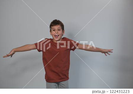 boy's playful lean and casual style highlight an effortless charm. It's a nod to the trend of embracing the unpolished, real-life moments in visual media. boy's playful lean and casual style highlight an effortless charm. It's a nod to the trend of embracing the unpolished, real-life moments in visual media. 122431223