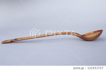 Wooden kitchen utensils stacked view close up 122431727