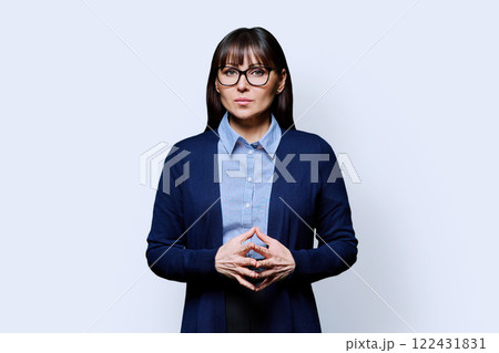 Portrait serious mature business woman on white background Portrait serious mature business woman on white background 122431831