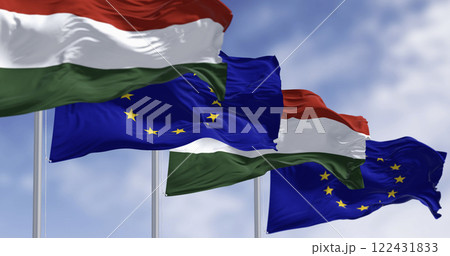 Flags of Hungary and the European Union fluttering together on a clear day 122431833