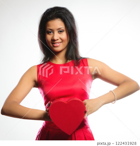 lovely woman with red heart shaped gift box lovely woman with red heart shaped gift box 122431928