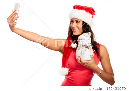 Girl holds snowman taking selfie 122431970