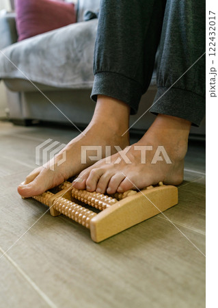 A man relaxing while having a foot massage 122432017