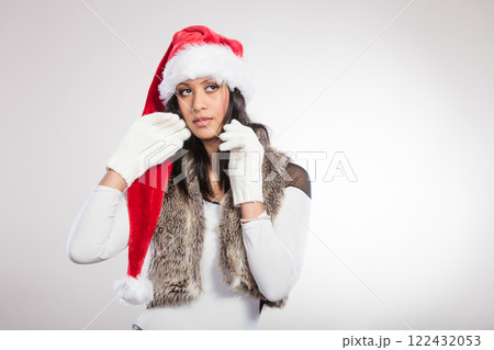 Woman mixed race santa helper hat portrait Woman mixed race santa helper hat portrait 122432053