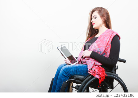 Disabled student with tablet ebook. Disabled student with tablet ebook. 122432196