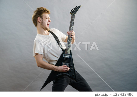 Man playing on electric guitar Man playing on electric guitar 122432496