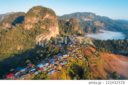 Colorful traditional village nestled among foggy mountain in countryside at Ban Jabo 122432578