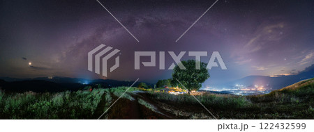 Milky way with starry over big tree on hill in the night 122432599