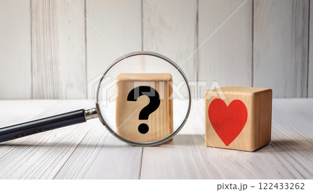 Magnifying Glass Focused on Question and Heart Blocks 122433262