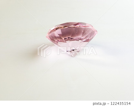 Pink crystal crystal on a white background. Semiprecious stone 122435154