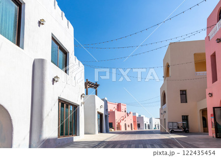 Colorful Mina village district street with arab traditional shaped buildings, Doha 122435454