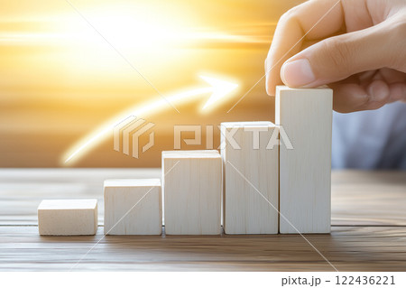 Hand Arranging Wooden Blocks for Business Growth and Success Concept with Sunlight Background 122436221