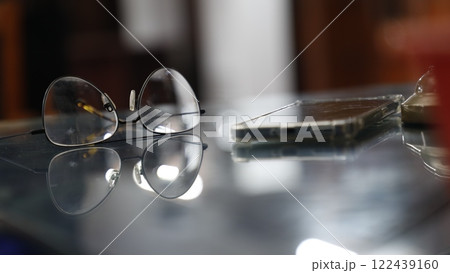 Eyeglasses on a table Eyeglasses on a table 122439160
