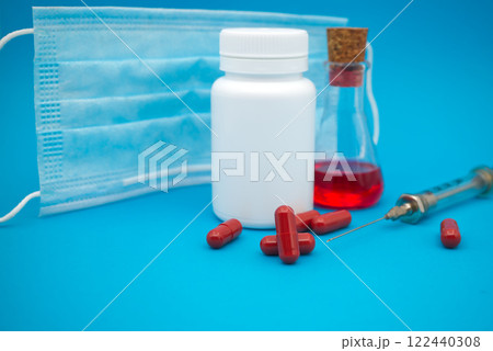 Medical, healthcare or Covid-19 still life with red capsules 122440308