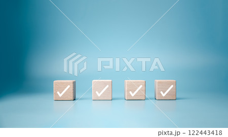 Checklist, Task list, Process success, Solving solution, Mission complete, Survey and assessment and voting, Quality Control, Goal achievement business, White correct check mark on wooden blocks. 122443418