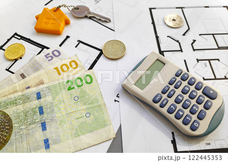 Danish krone banknotes on the top of building plans Danish krone banknotes on the top of building plans 122445353