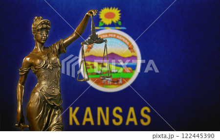 Lady Justice before a flag of Kansas 122445390