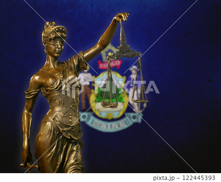 Lady Justice before a flag of Maine Lady Justice before a flag of Maine 122445393