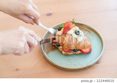 Fresh Strawberry and Blueberry Cream Croissant on a Rustic Ceramic Plate Fresh Strawberry and Blueberry Cream Croissant on a Rustic Ceramic Plate 122446010