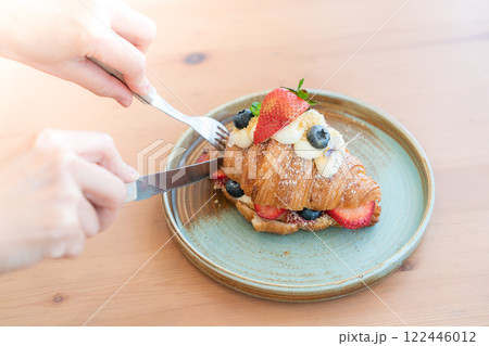 Fresh Strawberry and Blueberry Cream Croissant on a Rustic Ceramic Plate Fresh Strawberry and Blueberry Cream Croissant on a Rustic Ceramic Plate 122446012