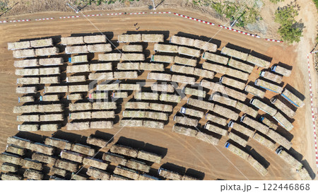 Drone shot aerial view of high angle view of a lot of sugarcane trucks queuing up Drone shot aerial view of high angle view of a lot of sugarcane trucks queuing up 122446868