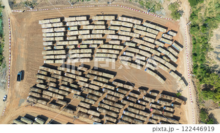 Drone shot aerial view of high angle view of a lot of sugarcane trucks queuing up Drone shot aerial view of high angle view of a lot of sugarcane trucks queuing up 122446919