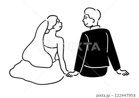 Bride and groom are sitting, gazing at each other lovingly, a cute couple 122447958