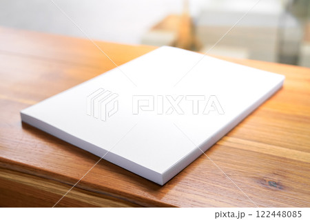 Blank White Book on Wooden Table 122448085