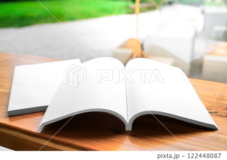 Blank White Book on Wooden Table 122448087