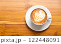 Hot Cappuccino with Latte Art on Wooden Table 122448091