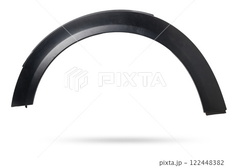 Black plastic fender flare on a white isolated background in a photo studio for sale or replacement in a car service. Mudguard on auto-parsing for repair or a device to protect the body from dirt. Black plastic fender flare on a white isolated background in a photo studio for sale or replacement in a car service. Mudguard on auto-parsing for repair or a device to protect the body from dirt. 122448382