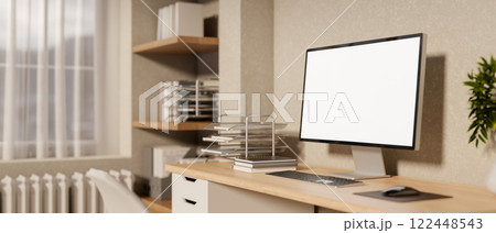 A side view of a minimalist Scandinavia home office workspace features a computer on a desk. 122448543