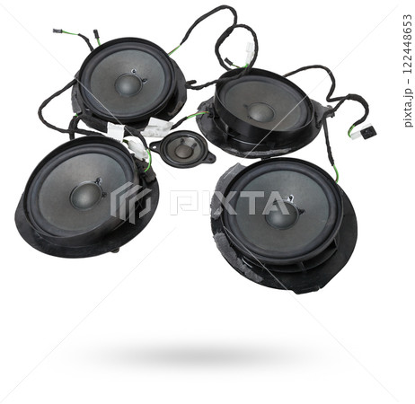 Two speakers of an acoustic system - an audio for playing music in a car interior on a white isolated background in a photo studio. Spare parts for auto repair in a workshop or for sale for tuning Two speakers of an acoustic system - an audio for playing music in a car interior on a white isolated background in a photo studio. Spare parts for auto repair in a workshop or for sale for tuning 122448653