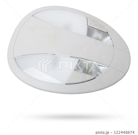 The removed spare part from the car on a white isolated background is the interior light in the ceiling for replacement and repair. Spare parts catalog. The removed spare part from the car on a white isolated background is the interior light in the ceiling for replacement and repair. Spare parts catalog. 122448674