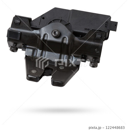 Detail of a car spare part made of black plastic and metal - rear trunk lock separately isolated on a white background. Repair in a car workshop, equipment for sale. 122448683