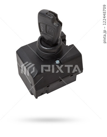 Electronic ignition lock with a key and a button made of black plastic on a white isolated background in a photography studio, a spare part for car repair or for sale in junk yard. 122448709