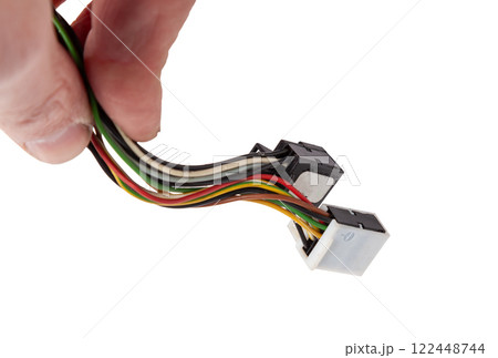 A cable of matted wires of different colors with connectors in the electrical wiring of the car. Internet line in the work of the provider. 122448744