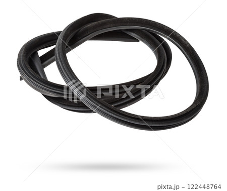 Rolled up black rubber sealant for elements of the car body, doors or trunk, for noise insulation, thermal and sound, preventing heat loss in the car interior. Sealing gasket for repair in a workshop. Rolled up black rubber sealant for elements of the car body, doors or trunk, for noise insulation, thermal and sound, preventing heat loss in the car interior. Sealing gasket for repair in a workshop. 122448764