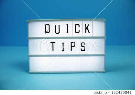 Quick Tips letterboard text on LED Lightbox on blue background 122450041