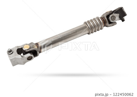 The spare part of the car is a metal steering propeller shaft with hinges on a white background with inscriptions designating the model. Repair of equipment at the auto-parsing in the workshop. The spare part of the car is a metal steering propeller shaft with hinges on a white background with inscriptions designating the model. Repair of equipment at the auto-parsing in the workshop. 122450062
