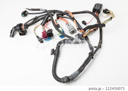 A cable of matted wires of different colors with connectors in the electrical wiring of the car. Internet line in the work of the provider. 122450071
