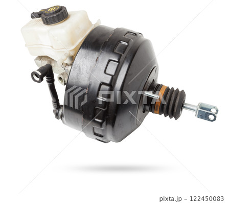 Black metal vacuum brake booster for repair and replacement on a car in a workshop on a white isolated background. Spare parts catalog for cars. 122450083
