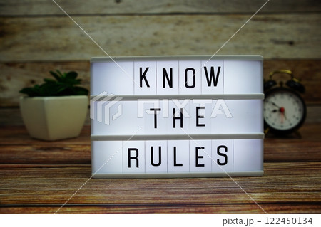 KNOW THE RULES letterboard text on LED Lightbox on wooden background, Business and Communication concept background KNOW THE RULES letterboard text on LED Lightbox on wooden background, Business and Communication concept background 122450134