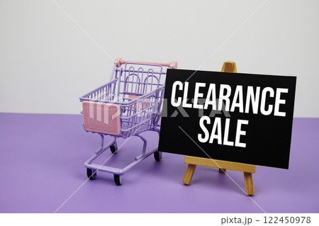 Clearance sale text message and trolley shopping cart on purple background Clearance sale text message and trolley shopping cart on purple background 122450978