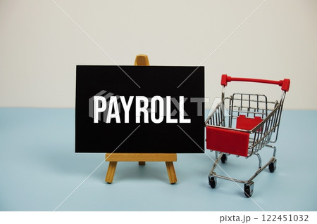 Payroll text message and trolley shopping cart on blue background Payroll text message and trolley shopping cart on blue background 122451032