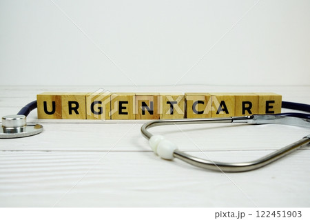Urgent Care with wooden blocks alphabet letters and stethoscope on wooden background, Healthy and wellness concept Urgent Care with wooden blocks alphabet letters and stethoscope on wooden background, Healthy and wellness concept 122451903