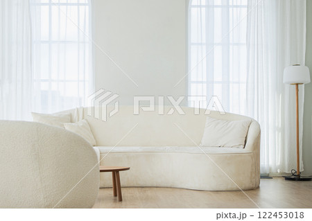 Stylish loft bedroom interior. Spacious design apartment with light walls large windows white couch sofa and armchair. Clean modern decoration with elegant furniture in minimalist Scandinavian style Stylish loft bedroom interior. Spacious design apartment with light walls large windows white couch sofa and armchair. Clean modern decoration with elegant furniture in minimalist Scandinavian style 122453018