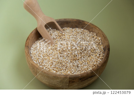 Raw fine ground barley porridge Gluten free cereals. Health gut benefits. Concept of alternative whole spelt grain ingredient. Vegetarian diet recipes. Plant-based lifestyle. Copy space Protein rich Raw fine ground barley porridge Gluten free cereals. Health gut benefits. Concept of alternative whole spelt grain ingredient. Vegetarian diet recipes. Plant-based lifestyle. Copy space Protein rich 122453079