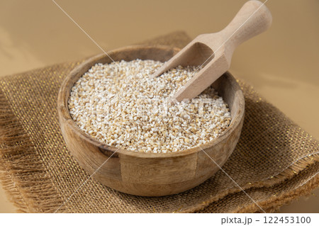 Raw fine ground barley porridge Gluten free cereals. Health gut benefits. Concept of alternative whole spelt grain ingredient. Vegetarian diet recipes. Plant-based lifestyle. Copy space Protein rich 122453100
